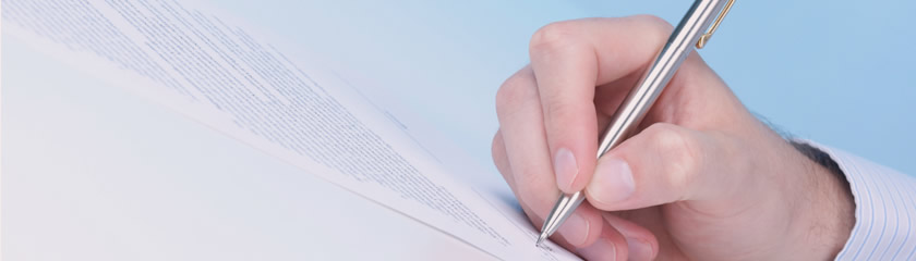 Image of a hand writing on paper